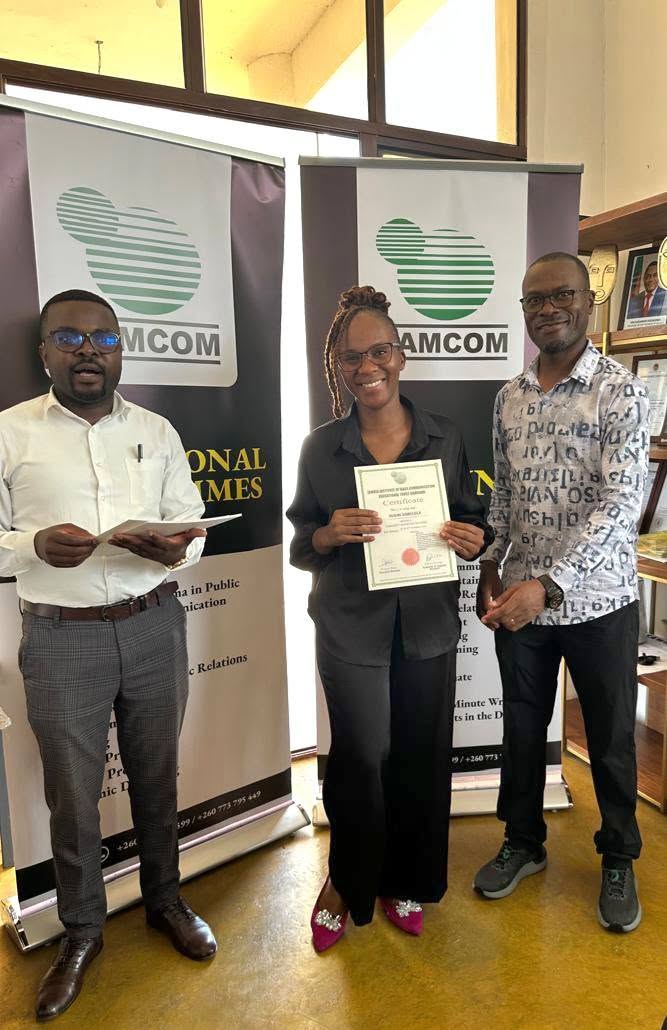 Participant receiving a certificate at a previous workshop